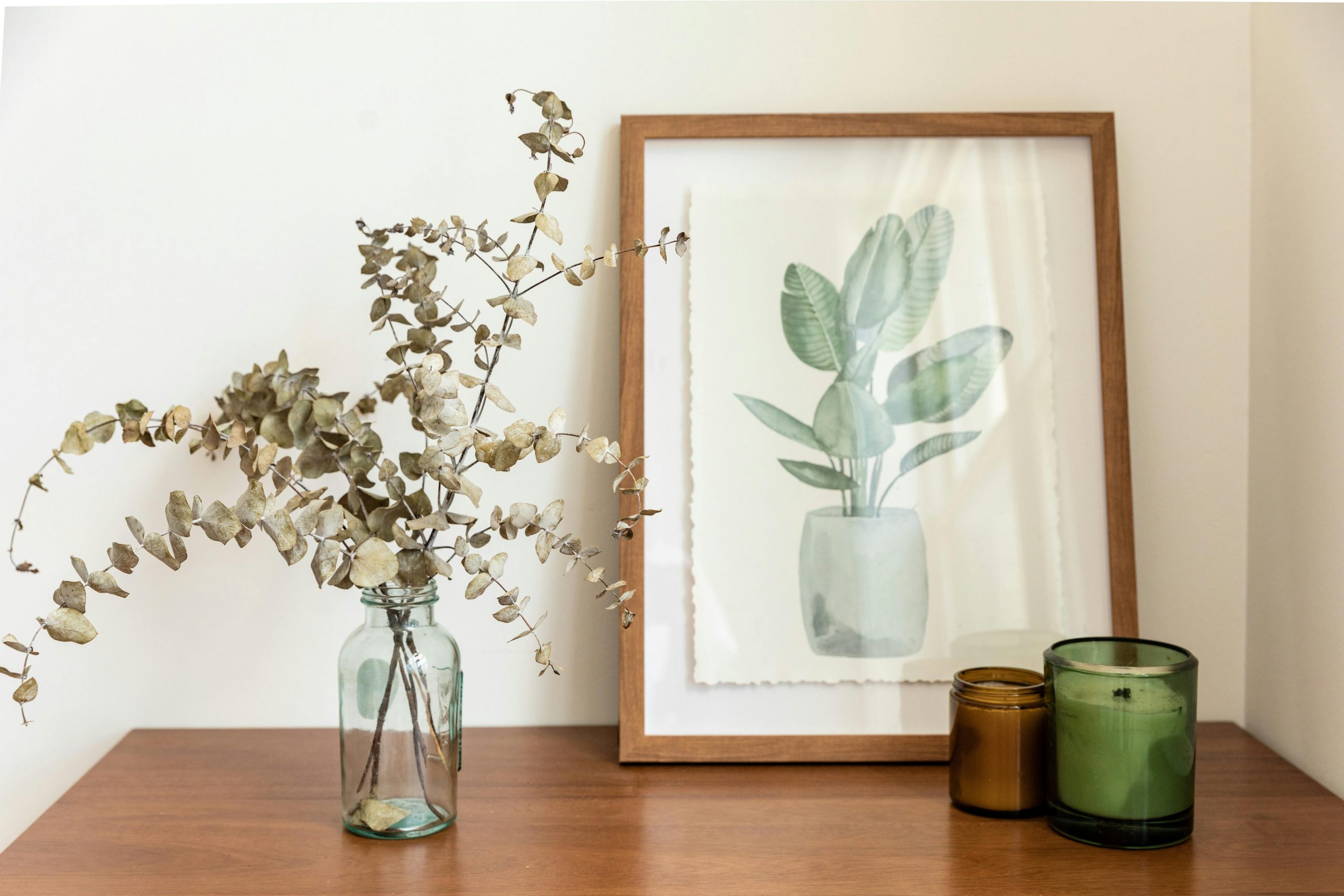 Candles and frames creatively arranged for home décor.