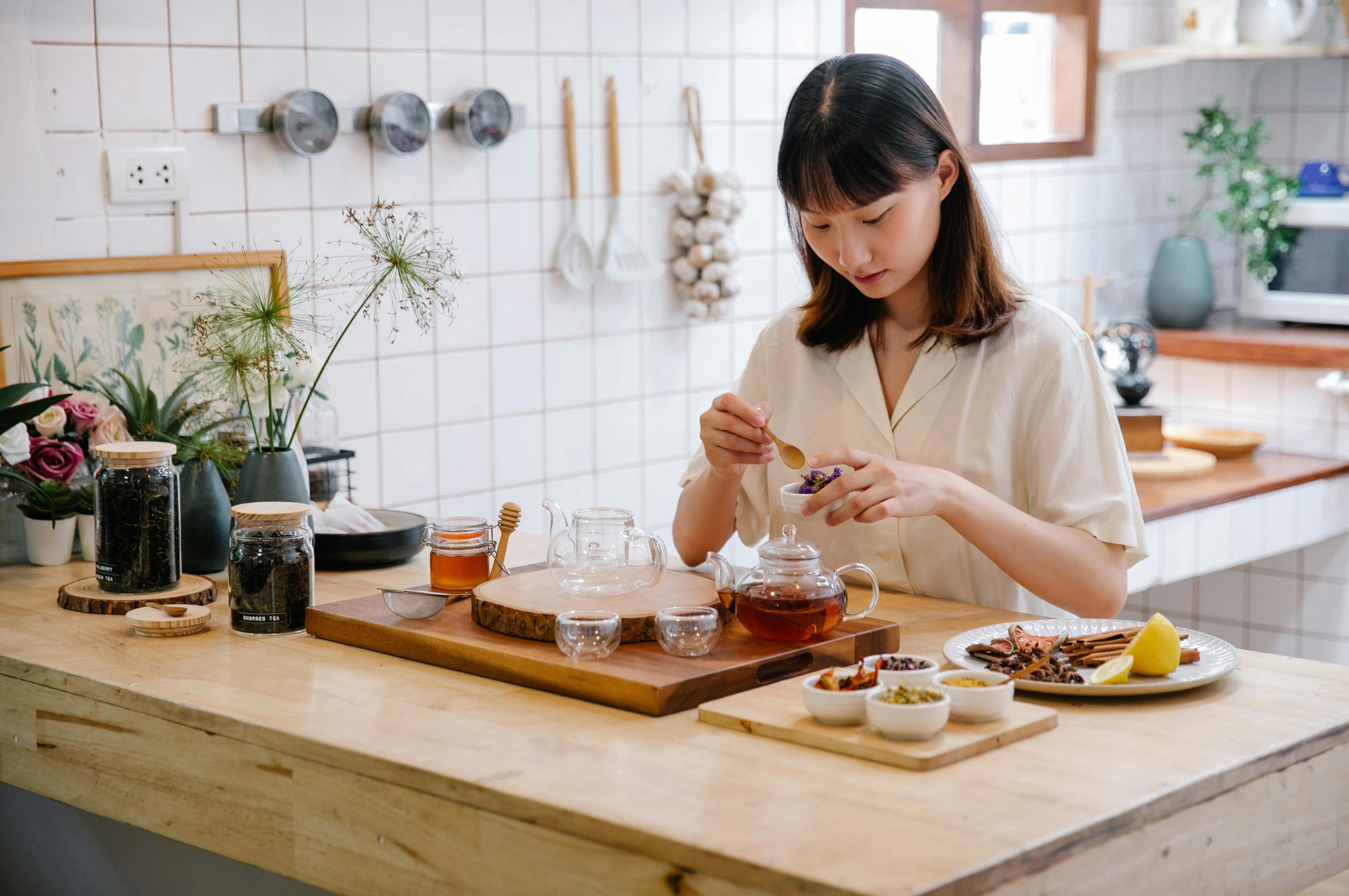 Set of homemade skincare jars made from natural ingredients like honey and lemon.